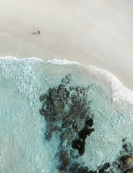 Aerial view of a person along the shoreline at Wylie Bay coastline, Esperance, Australia. - AAEF17775