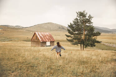 Happy woman running in Durmitor National Park - PCLF00332