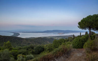 Italy, Tuscany, Monte Argentario, View from Monte Argentario peninsula at dusk - MAMF02748