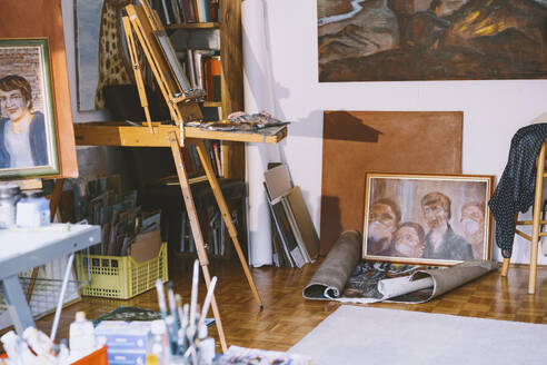 Paintings and art equipment in studio - NDEF00420
