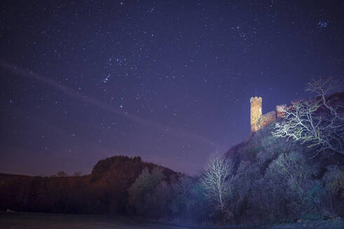 Germany, Rhineland-Palatinate, Holzheim, Starry night sky over Ardeck Castle - MHF00715