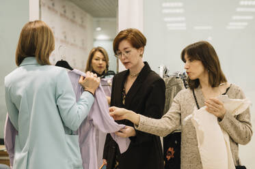 Woman with friends shopping together at store - ANAF01179