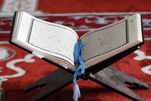 Open Quran and Muslim prayer beads on wood stand, symbol of Islam, An Giang, Vietnam, Indochina, Southeast Asia, Asia - RHPLF23728