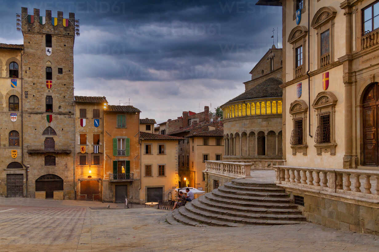 Medieval buildings in Piazza Grande at sunset Arezzo Tuscany