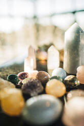 Variety of gemstones arranged on table at retreat center - MASF36390