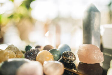 Gemstones and crystals arranged on table at retreat center - MASF36391