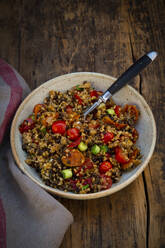 Bowl of Beluga lentils with bulgur, tomatoes, peppers, eggplant and scallion - LVF09306