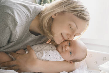 Mother embracing baby boy at home - NDEF00471