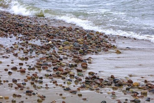 Germany, Mecklenburg-Vorpommern, Stones on sandy beach - JTF02326