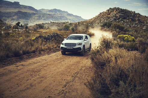 Car moving on dirt road at Cederberg Mountains - KOF00049