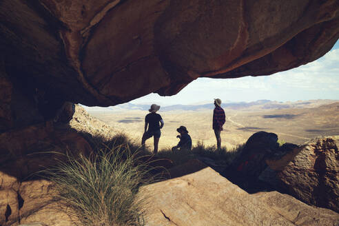 Friends taking break below large rock at Cederberg Mountain - KOF00058