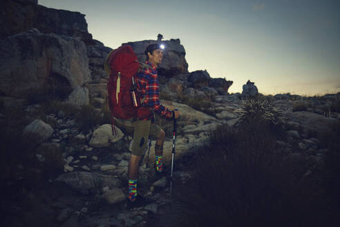 Man with backpack doing overnight hike at Cederberg Mountains - KOF00061