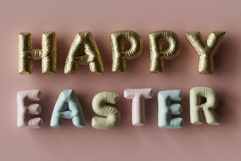 Three dimensional render of inflatable letters spelling phrase Happy Easter - GCAF00277