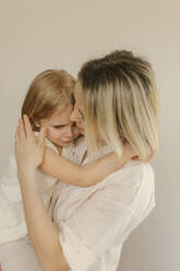 Mother consoling sad daughter at home - VIVF00609