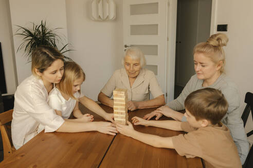 Multi-generation family playing game on table at home - VIVF00617