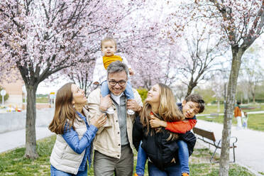 Happy family having fun at park - JJF00944