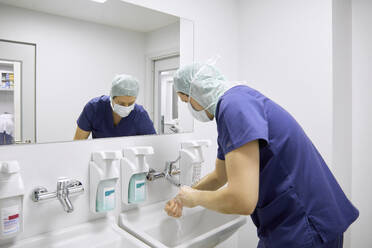 Surgeon washing hands before operation in hospital - SANF00102