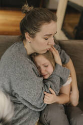 Mother consoling crying daughter at home - VIVF00823