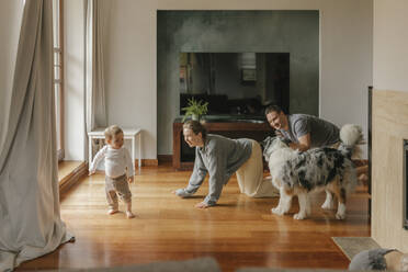 Playful family spending leisure time in living room - VIVF00839