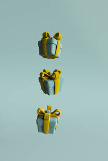 3D render of Christmas presents floating against green background - GCAF00316