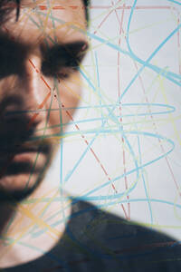Colorful scribbling with man behind glass - SVCF00384