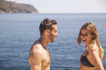 Happy man and woman enjoying vacation at sunny day - PCLF00463