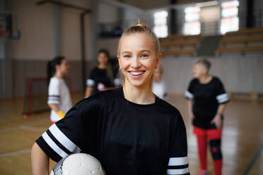 Young woman posing with a basketball ball before womans match. - HPIF09370