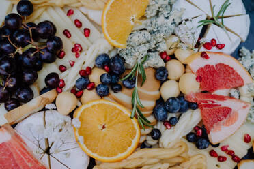 Close-up of a dessert buffet at small wedding reception outside in the backyard. - HPIF09525