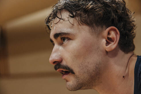Focused male athlete with mustache at sports court - MASF36847