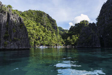 Reflection of mountains in sea at Coron Island in Philippines - PNAF05277