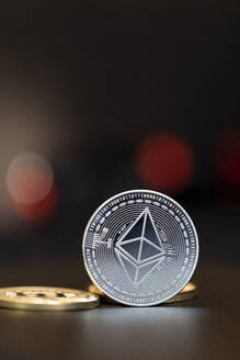Close-up of silver colored Ethereum coin - MMAF01449