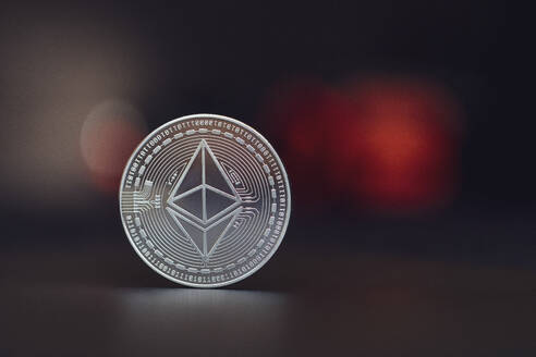 Close-up of silver colored Ethereum coin - MMAF01450