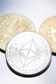 Close-up of Bitcoin and Ethereum coins - MMAF01454