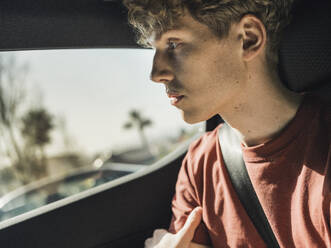 Thoughtful man sitting in car - MFF09311