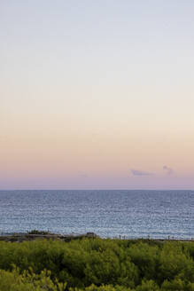 Spain, Balearic Islands, Formentera, Sky over Mediterranean coast at dusk - MMAF01455