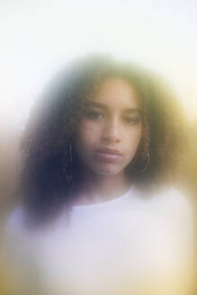 Serious young woman with curly hair - MRAF00939