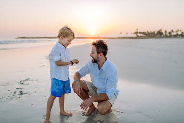 Father with his son enjoying together time at the sea. - HPIF09630