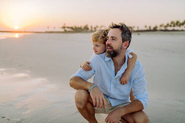 Father with his son enjoying together time at the sea. - HPIF09631