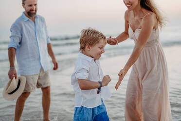 Happy family with little son enjoying time at the sea in exotic country. - HPIF09645