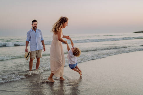 Happy family with little son enjoying time at the sea in exotic country. - HPIF09646