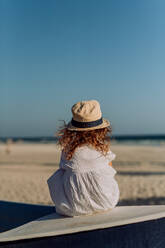 Rear view of little girl looking at the ocean. - HPIF09776