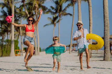 Happy family with little child enjoying time at vaccation in exotic country. - HPIF09837