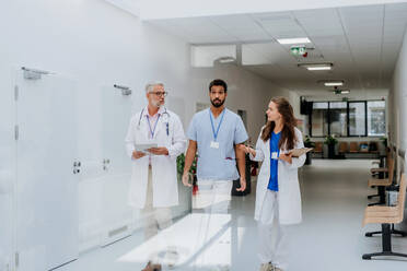 Team of doctors meeting at a hospital corridor. - HPIF09900