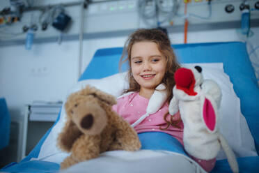 Portrait of little girl in a hospital room with her toys. - HPIF10349