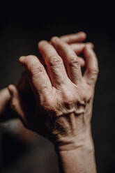 Close up of a wrinkled hands, copy space. - HPIF11854