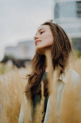 Portrait of happy young woman outdoor in city park with a sunglasses. - HPIF12513