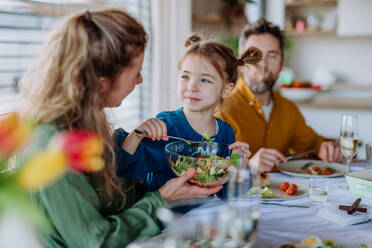 Happy family having Easter lunch together in home. - HPIF12839