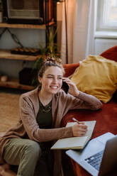 Young woman having home office in the apartment. - HPIF12920