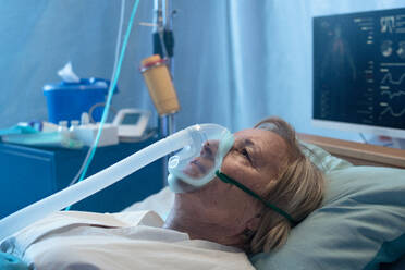 Close-up of covid-19 infected patient in bed in hospital, coronavirus and ventilation concept. - HPIF14002