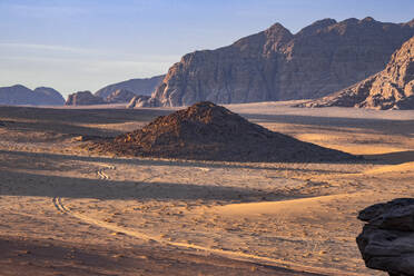 Wadi Rum plain at sunrise with soft light over the sand dunes and mountains, UNESCO World Heritage Site, Jordan, Middle East - RHPLF24019
